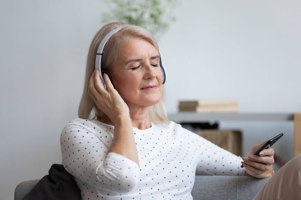 Older woman listening to music