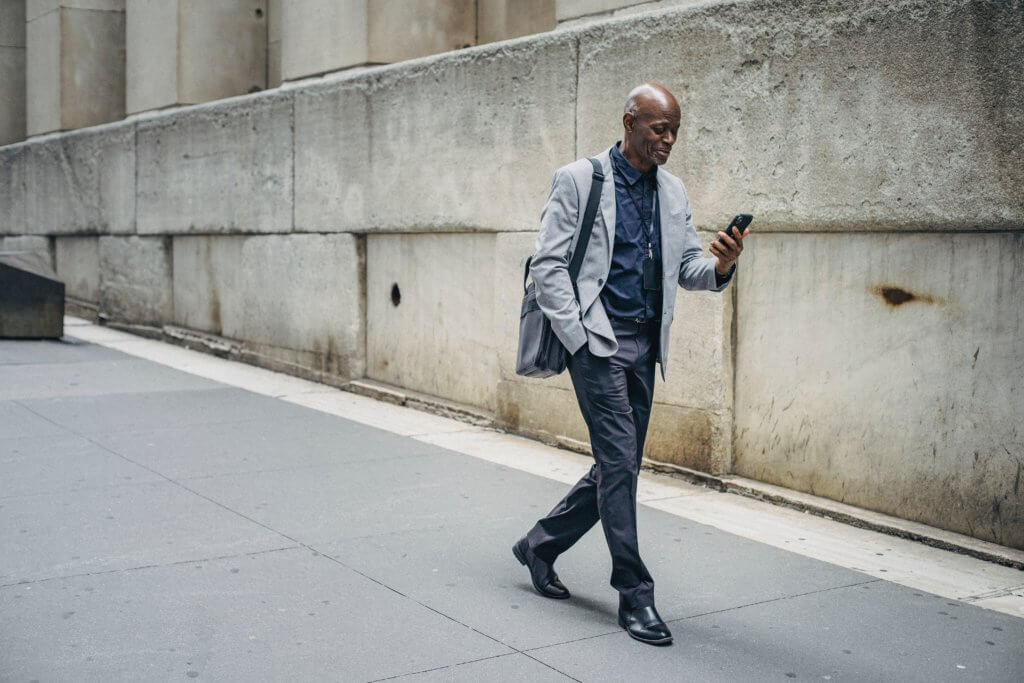 Man walking and texting