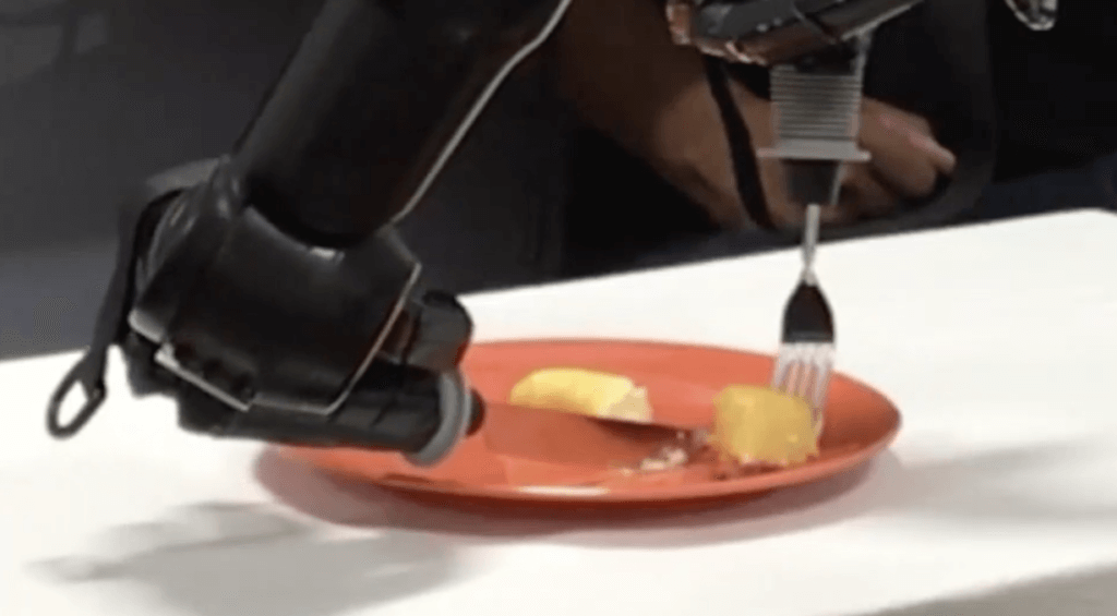 Man uses robotic arm