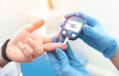Checking blood sugar levels of diabetes patient