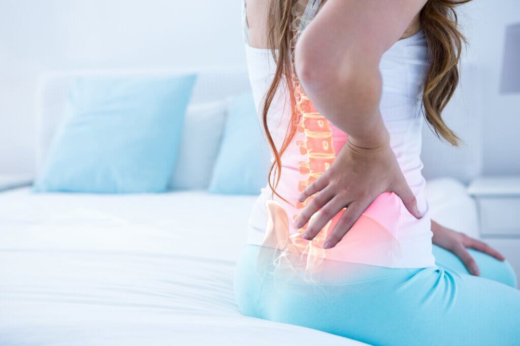 Woman battling lower back pain