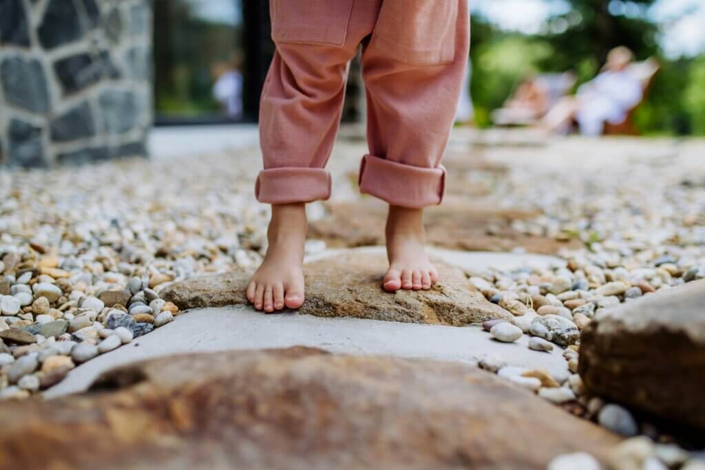 Feet walking on stepping stones