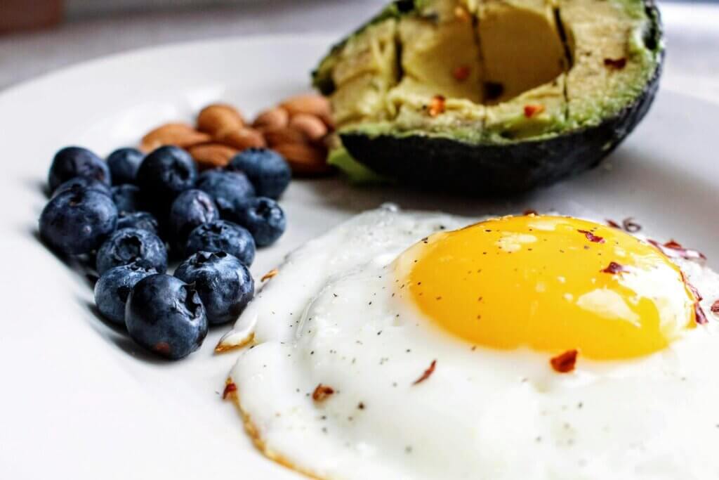 Eggs with avocado and blueberries